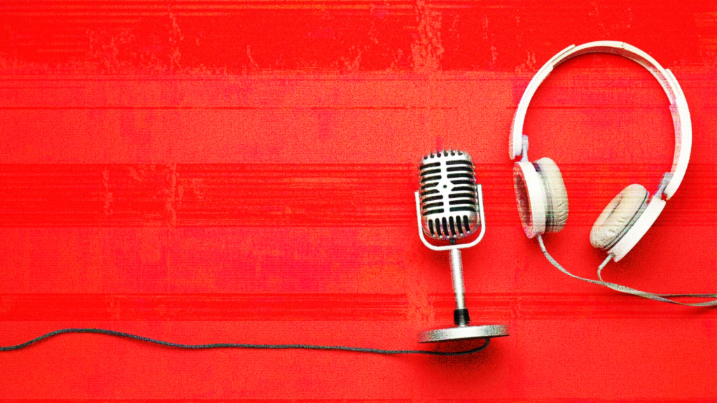 A table with a new podcast microphone and headphones.