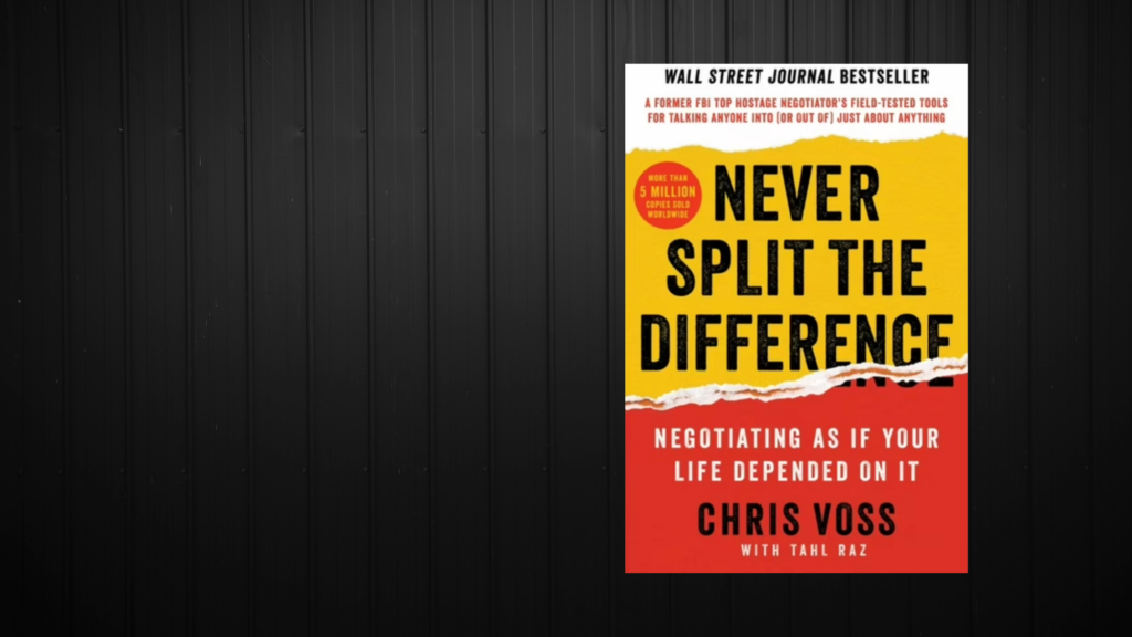 A book entitled "Never Split the Difference" by Chris Voss.