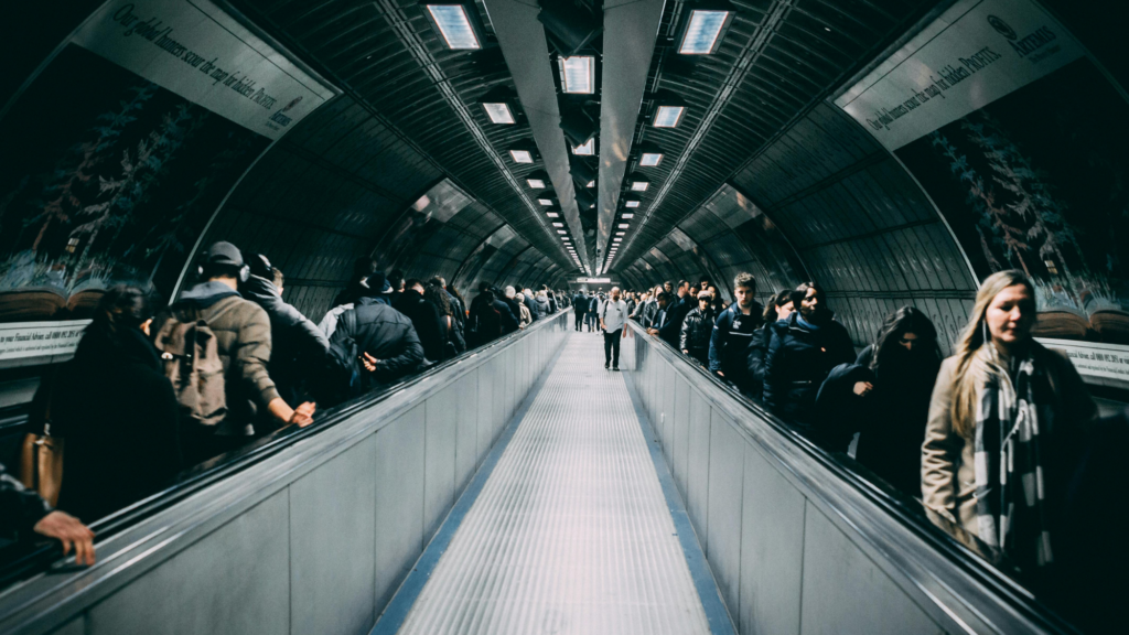 A subway tunnel (or lead funnel) full of people coming and going.