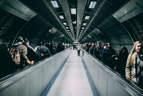 A subway tunnel (or lead funnel) full of people coming and going.