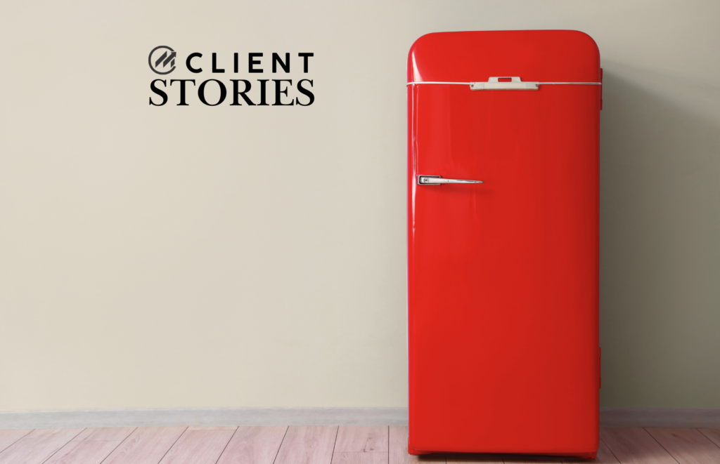 An appliance built to last: a red vintage fridge in a minimalist kitchen.